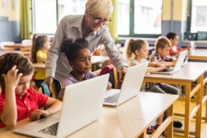 Classroom of kids using computers