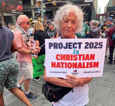 An older white woman supporting the separation of church and state at an anti-Project 2025 rally