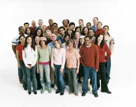 Studio Shot of a Large Mixed Age, Multiethnic Group of Smiling Men and Women