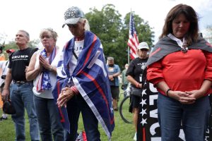 WASHINGTON, DC - SEPTEMBER 24: Demonstrators participate in a prayer during a “January 6th Solidarity Truth Rally” near the U.S. Capitol on September 24, 2022 in Washington, DC. Demonstrators who support people who have been prosecuted in the January 6th insurrection at the U.S. Capitol gather at the rally “to stand united and show our strength in numbers by protesting conservative political persecution in the heart of the American capitol.”