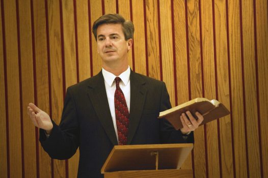 Pastor preaches from the pulpit