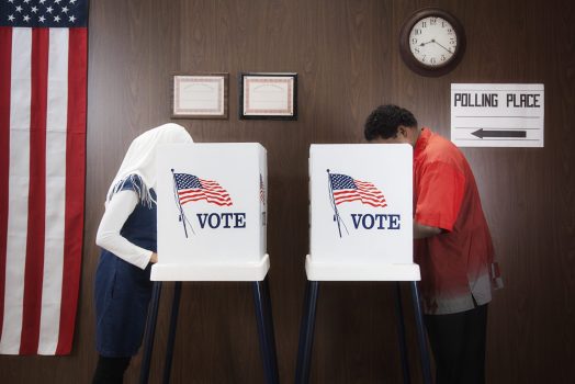 Voters voting in polling place Voters voting in polling place