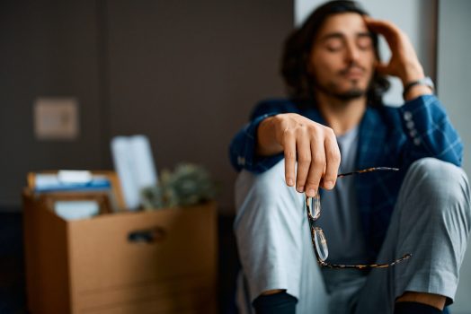Close up of depressed businessman after being fired from his job. Close up of worried businessman gets fired at work. Copy space.