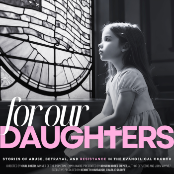 a girl sitting in front of a stained glass window